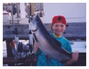 Young man with large fish caught with Capt. John Wagner aboard the Playin' Hooky Charter boat off Chicago